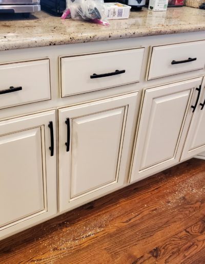 Oil Rubbed Bronze Subtle Arch Handles on Cream Lower Kitchen Cabinets